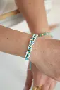 Gevlochten armband met bloemetjes - oranje/goud